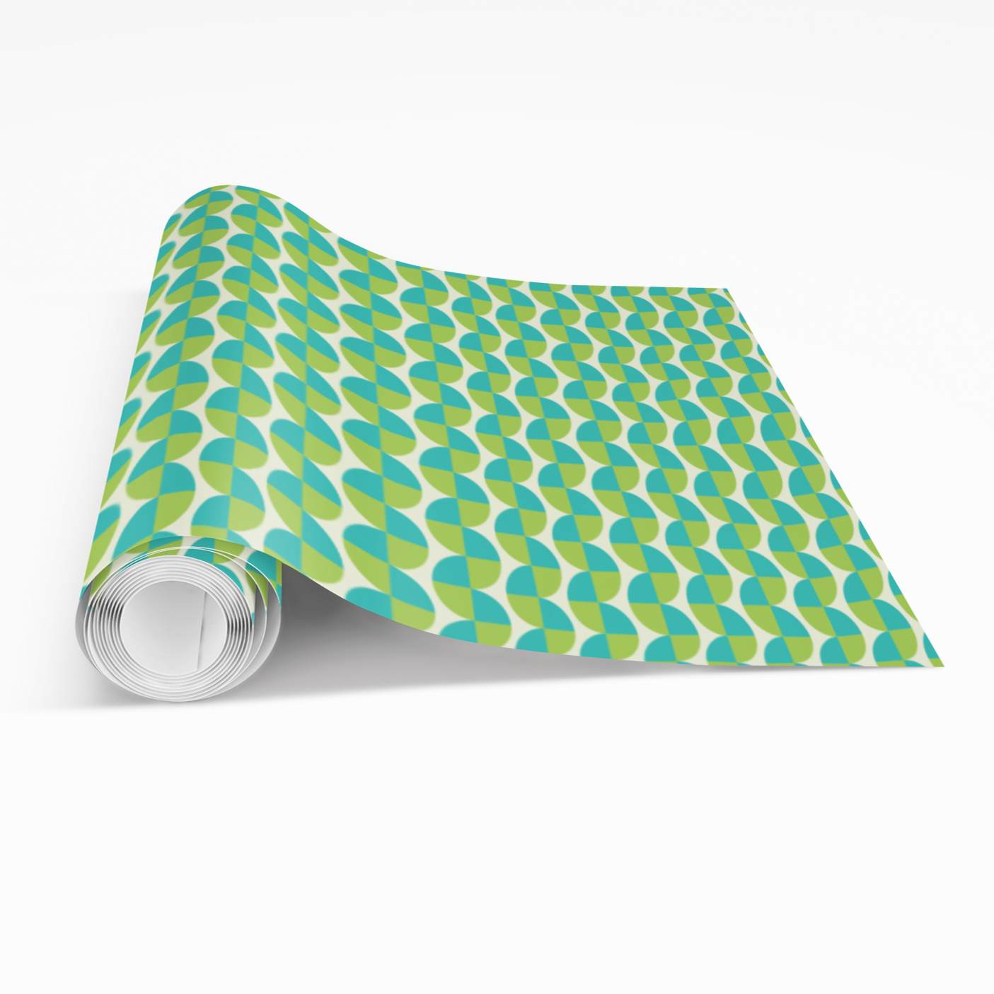 Roll of green and blue patterned paper on a white background