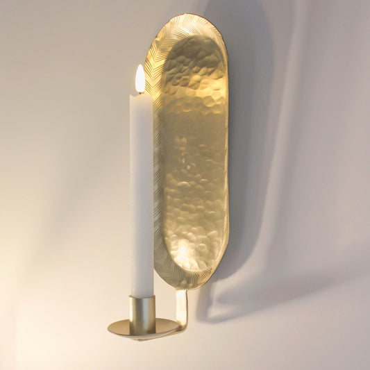 wall candle holders with a brass hammered finish