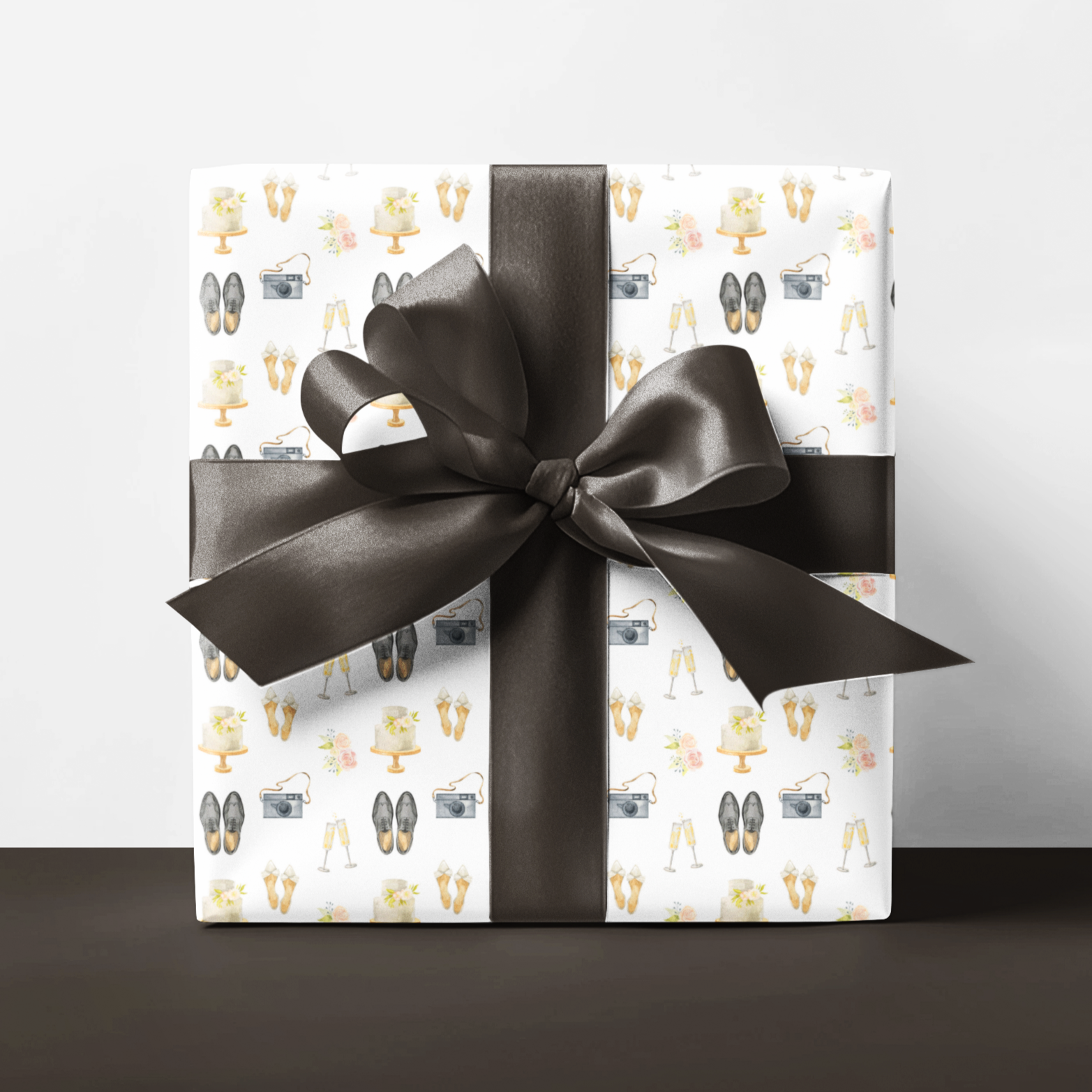 Wedding gift wrap featuring camera, shoes, cake and champagne
