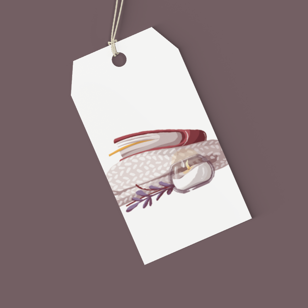 White tag with a colourful illustration of a books cosy blankets candle and foliage