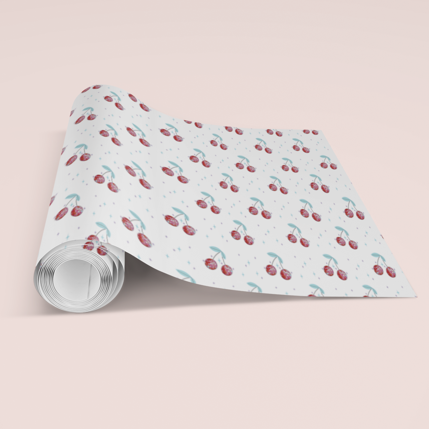 Roll of paper with cherry pattern on a light pink background