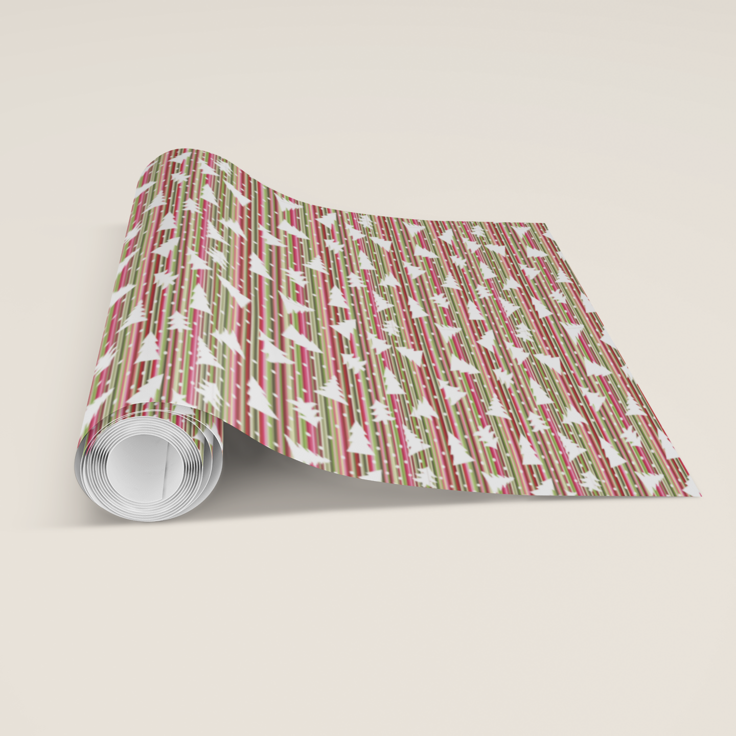 Roll of patterned Christmas paper with red and green striped design featuring white Christmas tress, perfect for him her on a beige background