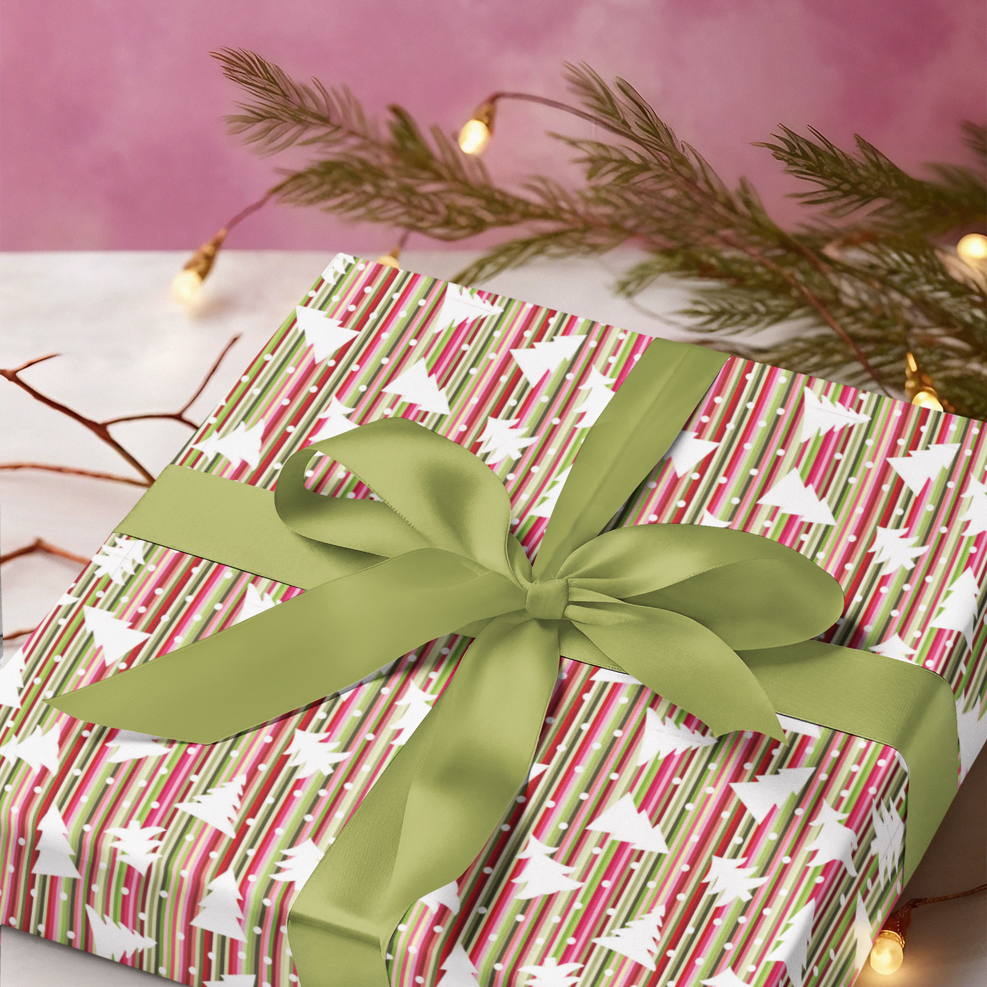 Gift wrapped in red and green patterned paper with a green bow on a white surface. Christmas luxury