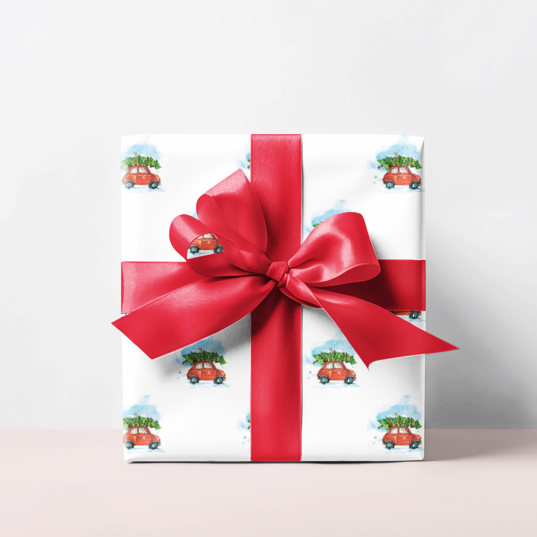 Gift box with a red ribbon on a light background