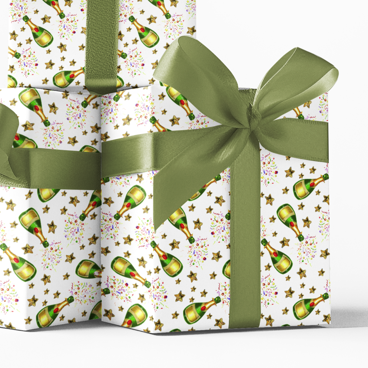 Three gift boxes with colourful celebratory champagne  pattern and green ribbons on a white background